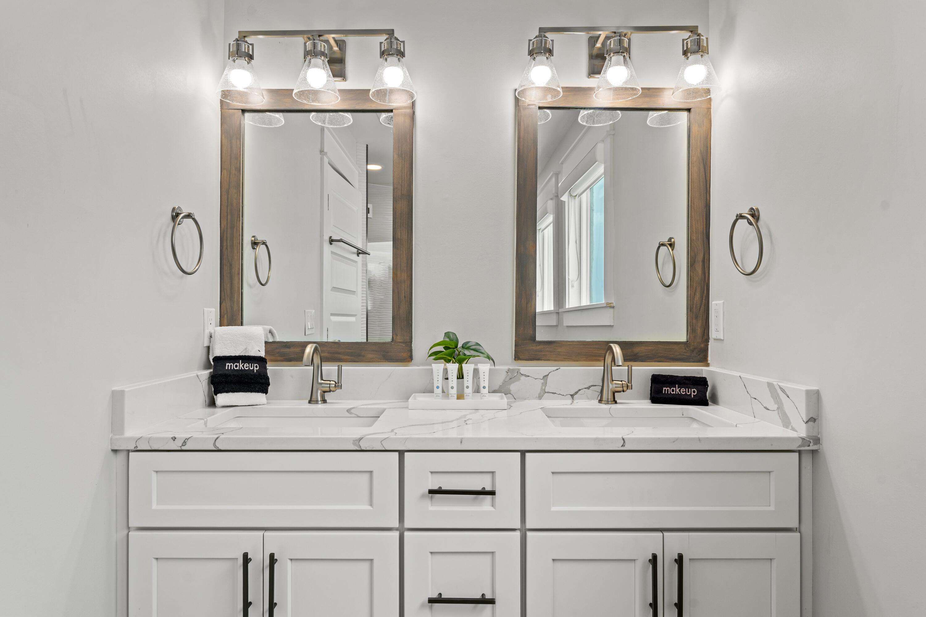 128 Blue Mountain Road, Unit 3 Santa Rosa Beach, FL 32459 - Photo 24 of 33 a bathroom with double vanity sinks and a mirror