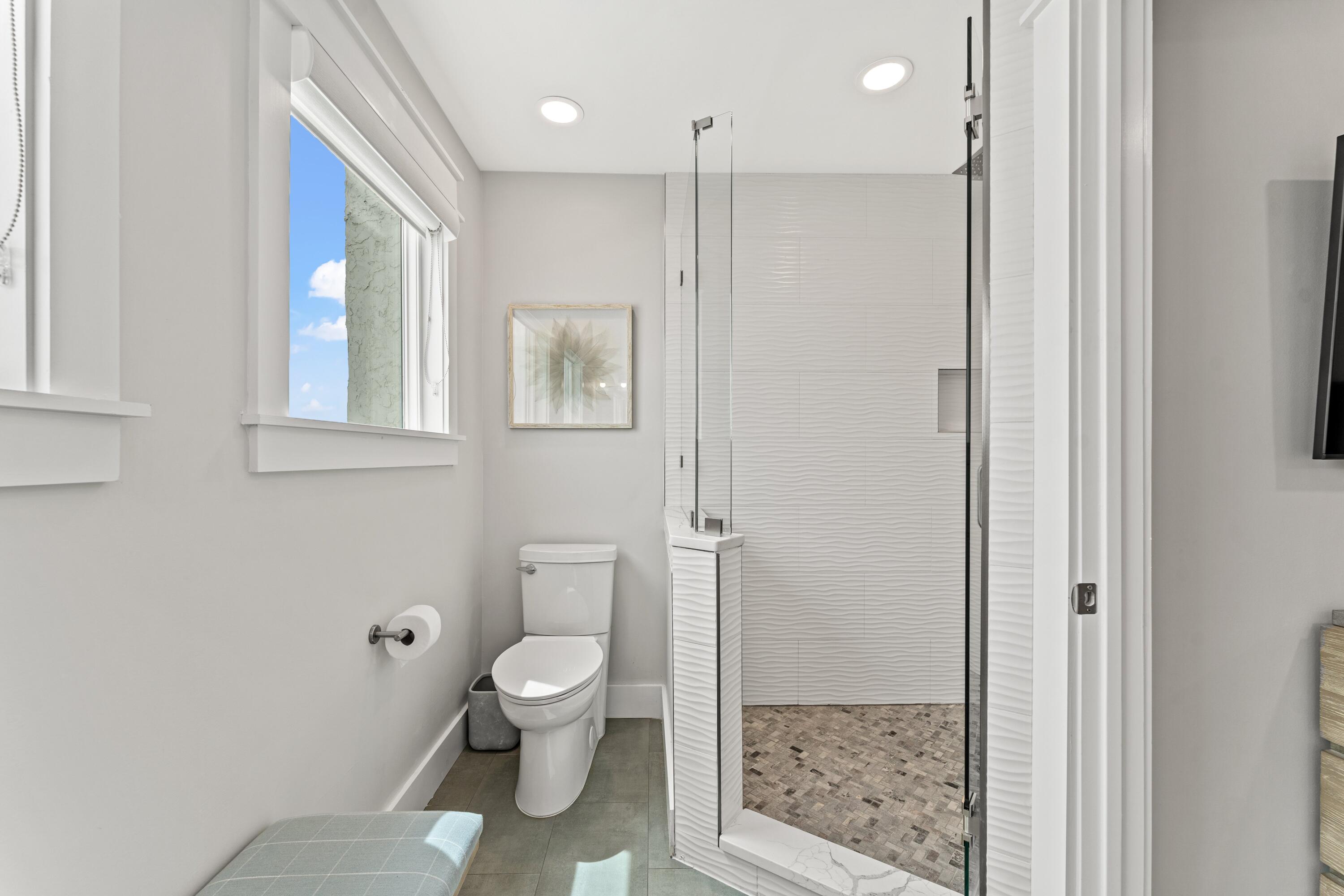 128 Blue Mountain Road, Unit 3 Santa Rosa Beach, FL 32459 - Photo 25 of 33 a bathroom with a shower a toilet and a sink