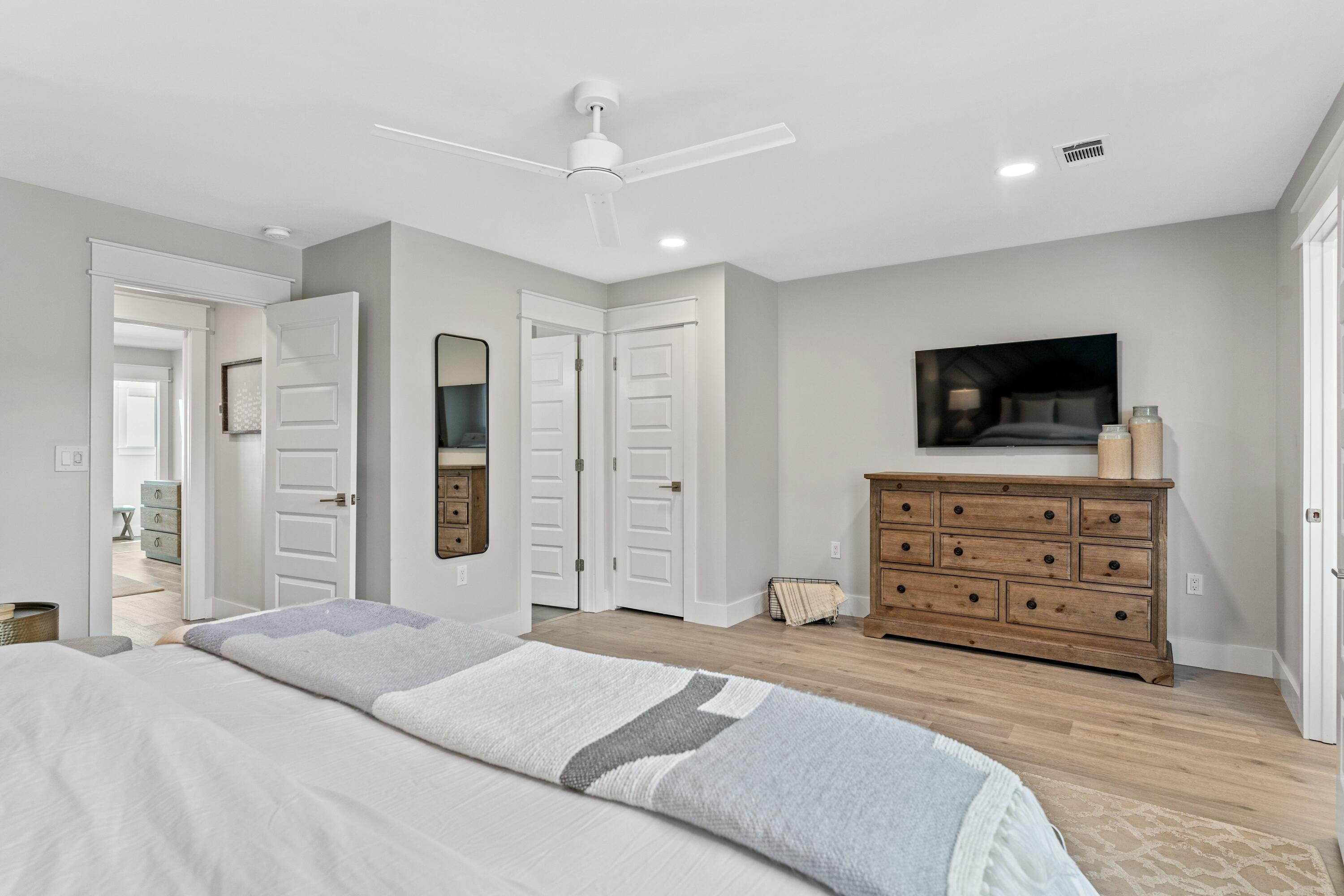 128 Blue Mountain Road, Unit 3 Santa Rosa Beach, FL 32459 - Photo 29 of 33 a bedroom with a bed and cabinets