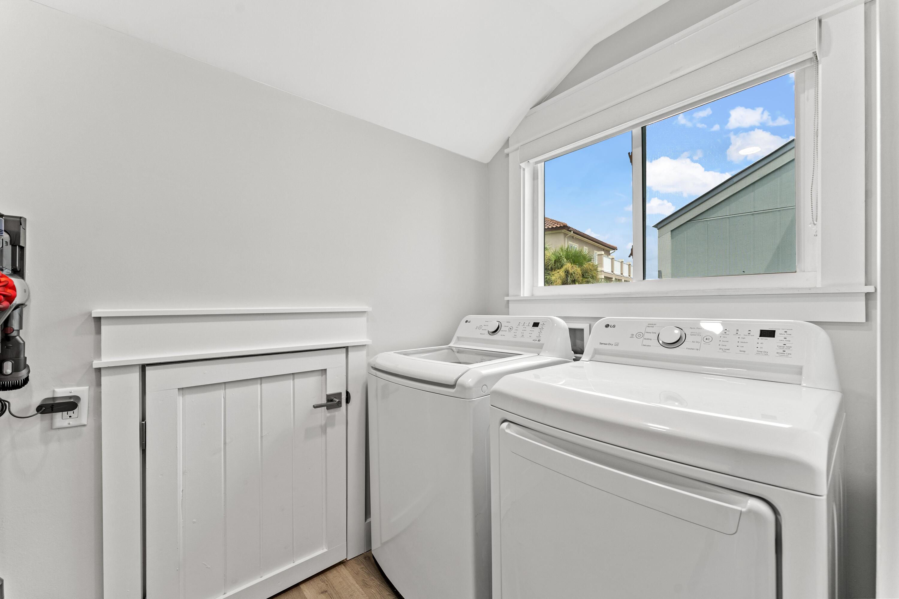 128 Blue Mountain Road, Unit 3 Santa Rosa Beach, FL 32459 - Photo 31 of 33 a view of washer and dryer with bathroom in the background