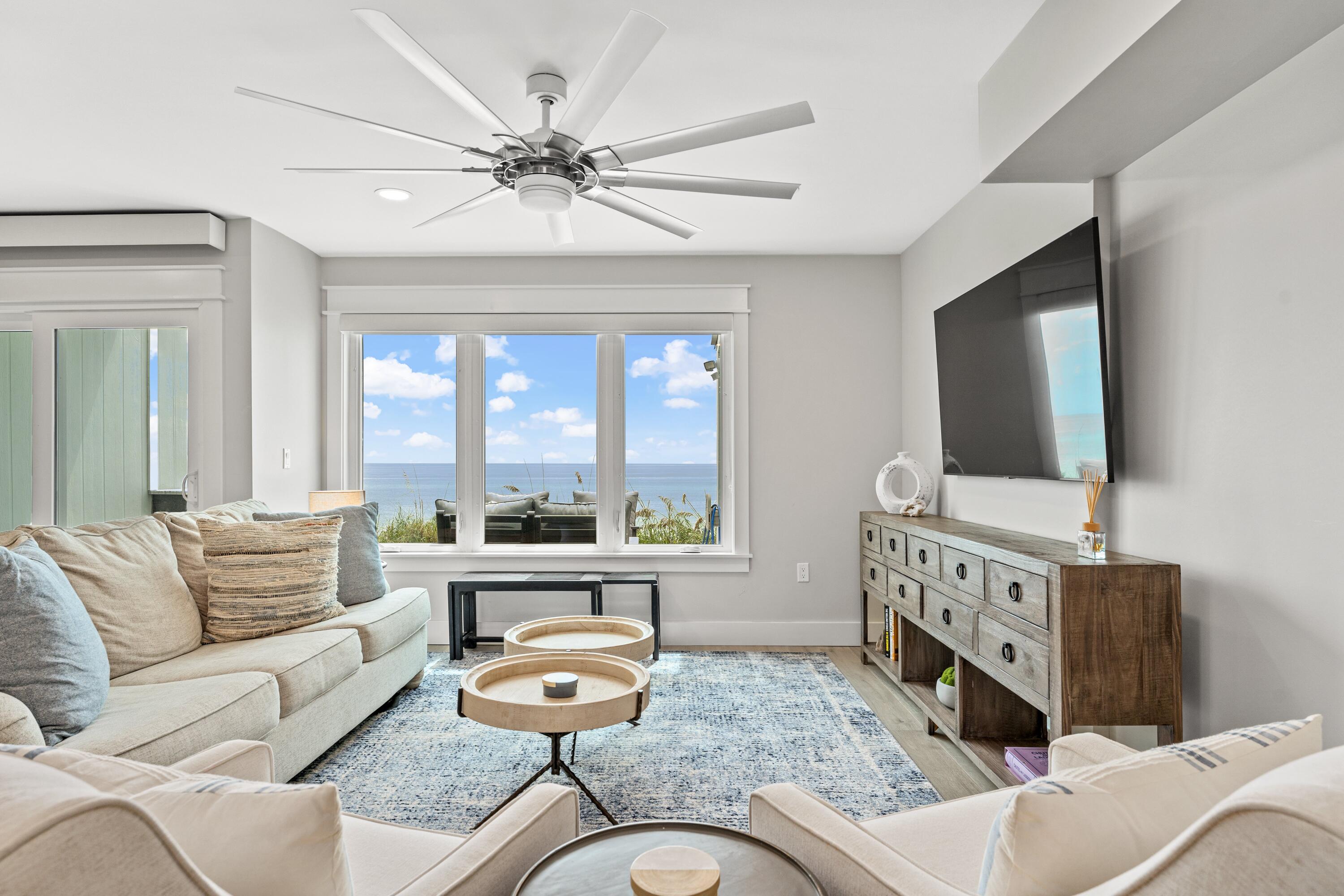 128 Blue Mountain Road, Unit 3 Santa Rosa Beach, FL 32459 - Photo 8 of 33 a living room with furniture and a flat screen tv