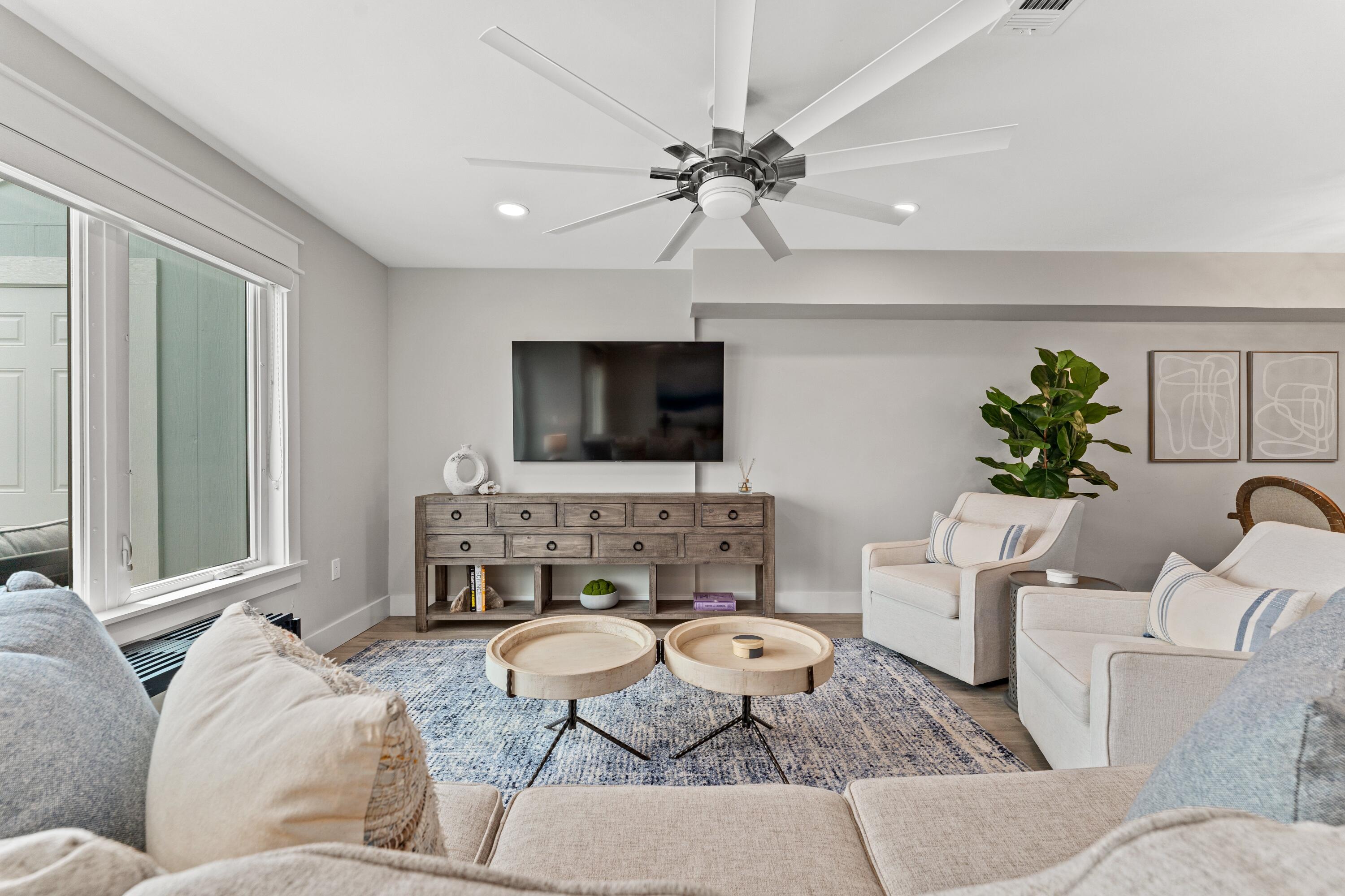 128 Blue Mountain Road, Unit 3 Santa Rosa Beach, FL 32459 - Photo 10 of 33 a living room with furniture and a flat screen tv