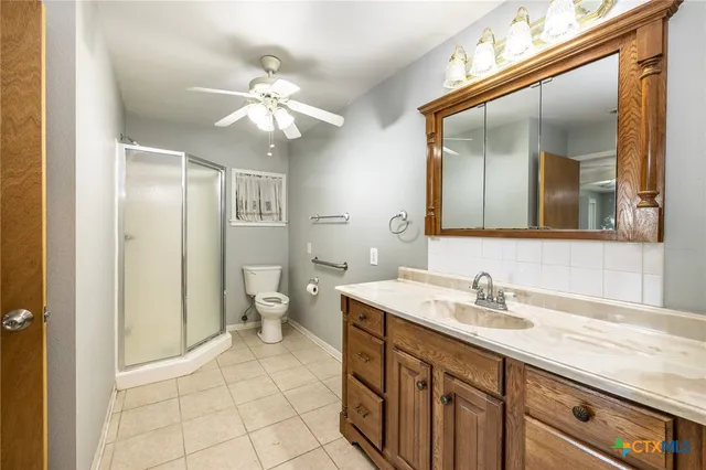 a bathroom with a sink vanity and a mirror