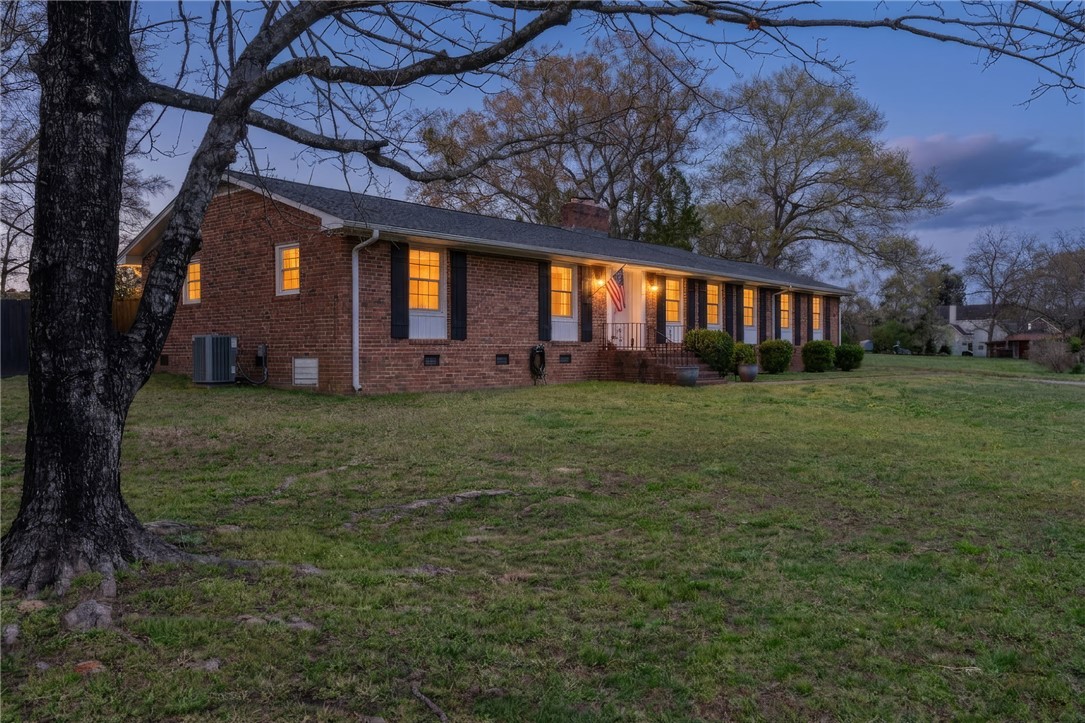 300 Green Street Williamston, SC 29697 - Photo 1 of 47 This charming residence features a classic brick exterior and a welcoming front entrance.