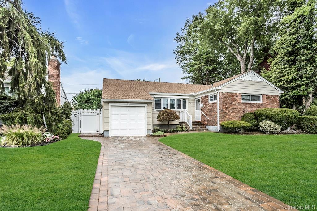 208 Daniel Road North Massapequa, NY 11758 - Photo 1 of 1 a front view of a house with a garden and porch
