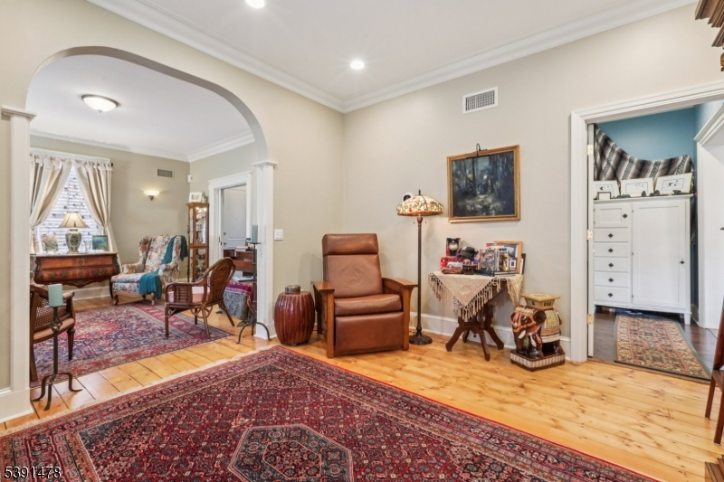 1035 Littleton Road Parsippany, NJ 07054 - Photo 11 of 47 a room with furniture a rug and a flat screen tv