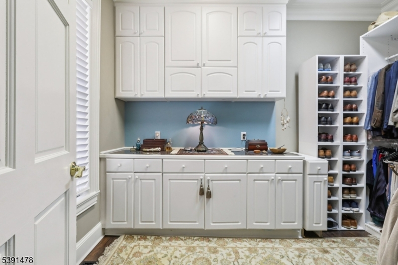 1035 Littleton Road Parsippany, NJ 07054 - Photo 17 of 47 a kitchen with white cabinets and sink