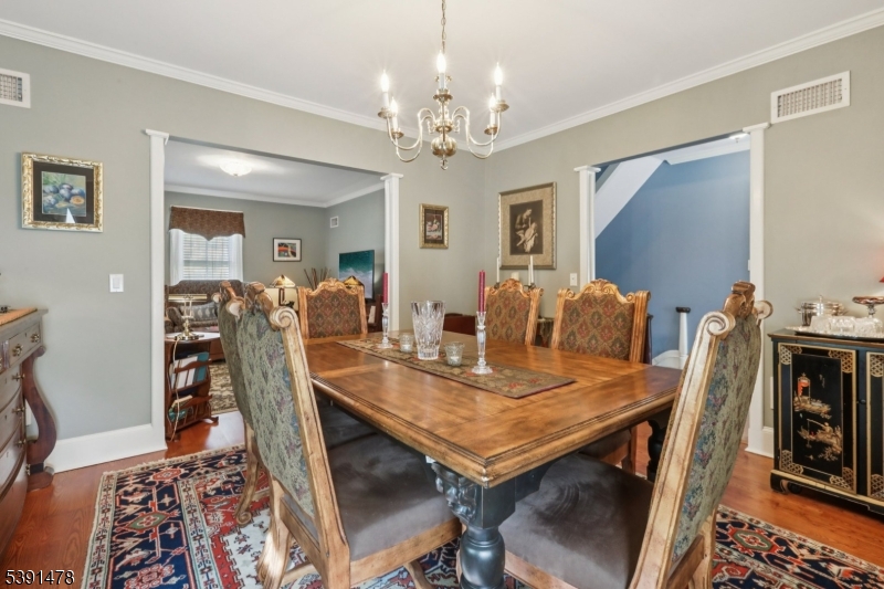 1035 Littleton Road Parsippany, NJ 07054 - Photo 31 of 47 a view of a dining room with furniture and wooden floor