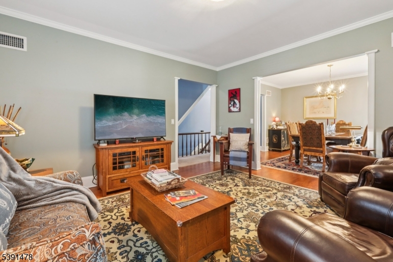 1035 Littleton Road Parsippany, NJ 07054 - Photo 34 of 47 a living room with furniture and a flat screen tv