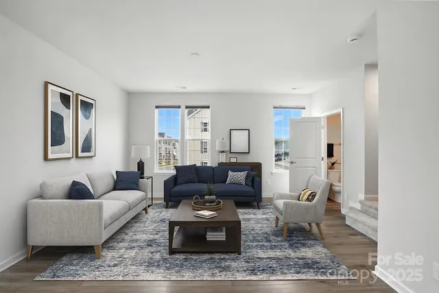 a view of a kitchen with wooden floor and a window