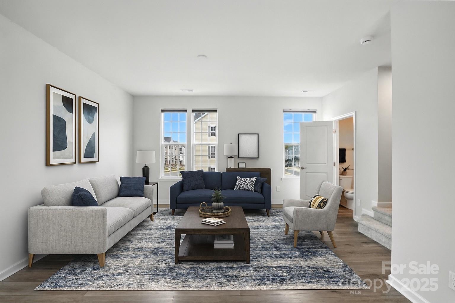 2108 Trout Lily Lane, Unit 198 Matthews, NC 28104 - Photo 23 of 45 a living room with furniture and a rug