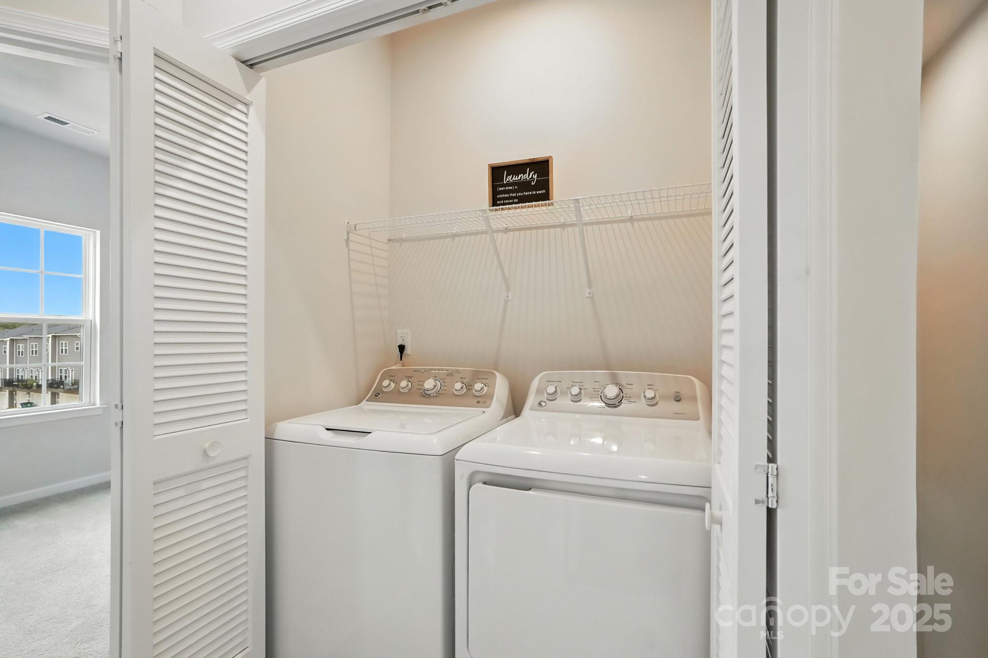 2108 Trout Lily Lane, Unit 198 Matthews, NC 28104 - Photo 28 of 45 a utility room with dryer and washer
