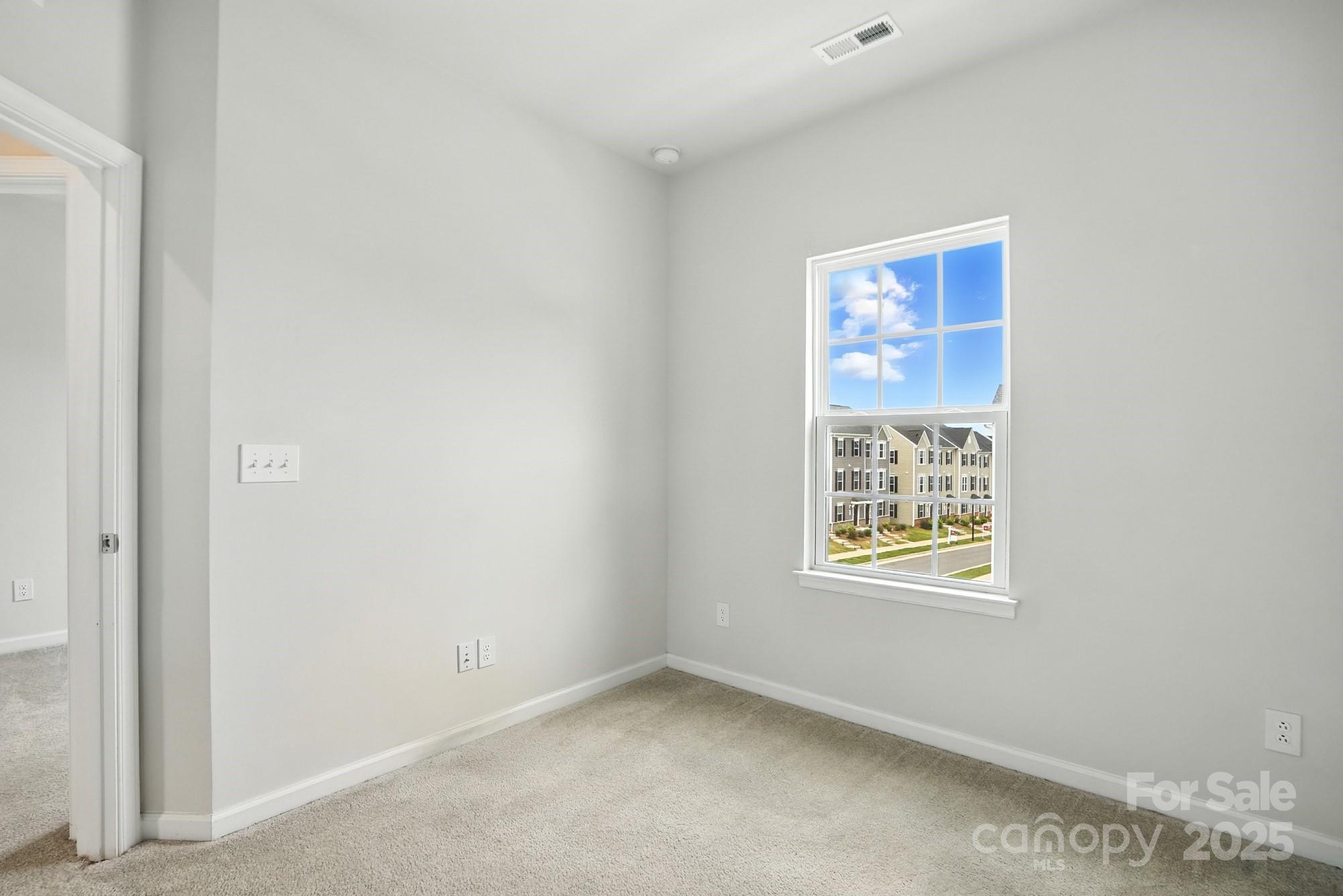 2108 Trout Lily Lane, Unit 198 Matthews, NC 28104 - Photo 34 of 45 an empty room with windows
