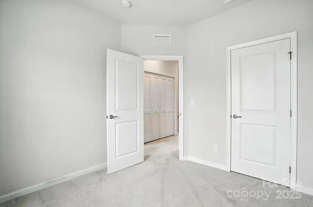 a bathroom with a sink a toilet a mirror and shower