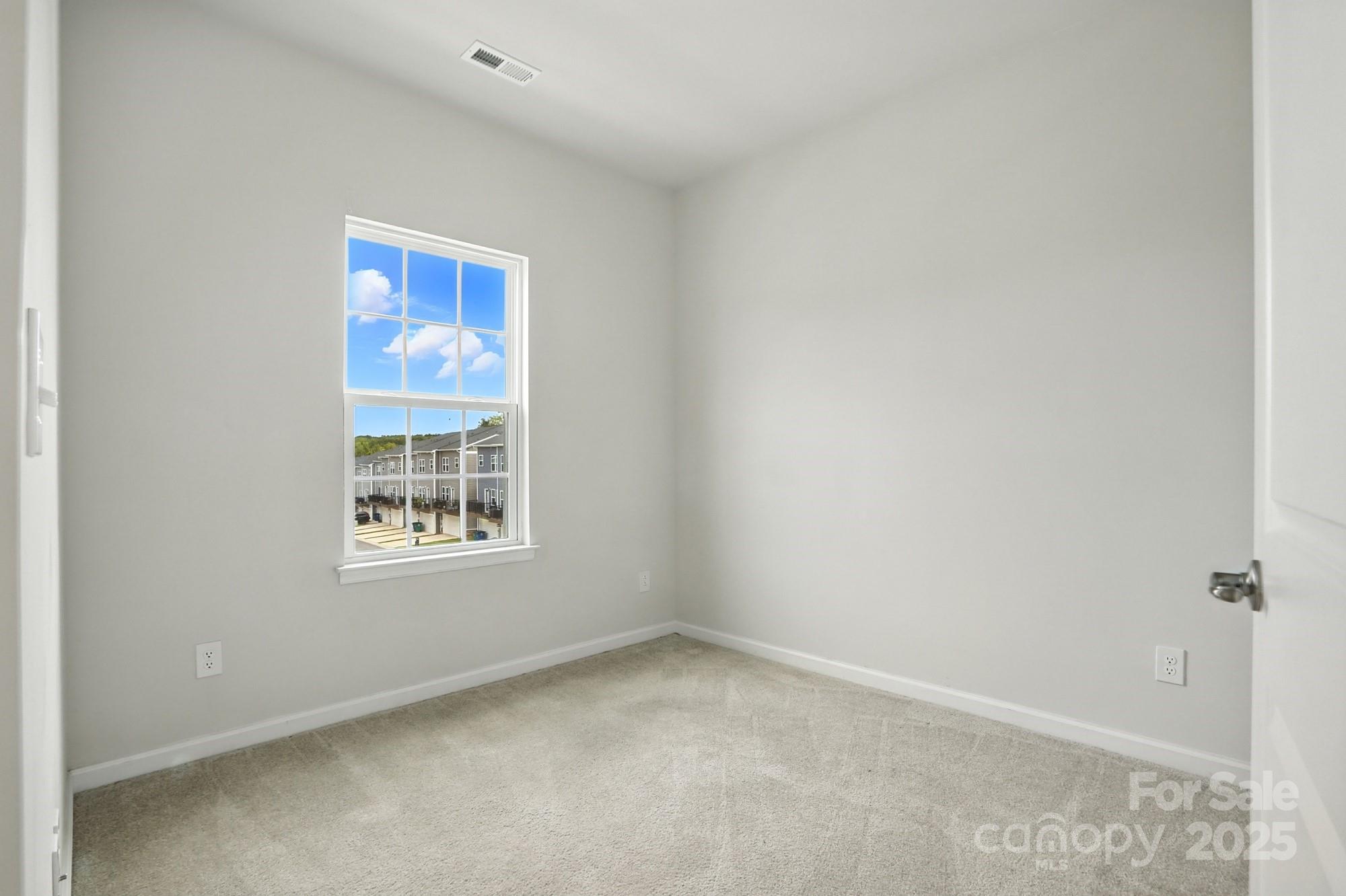 2108 Trout Lily Lane, Unit 198 Matthews, NC 28104 - Photo 37 of 45 an empty room with windows