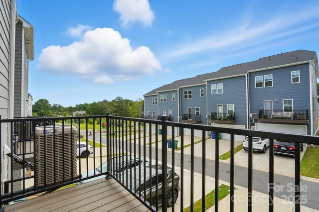 a view of balcony with wooden floor
