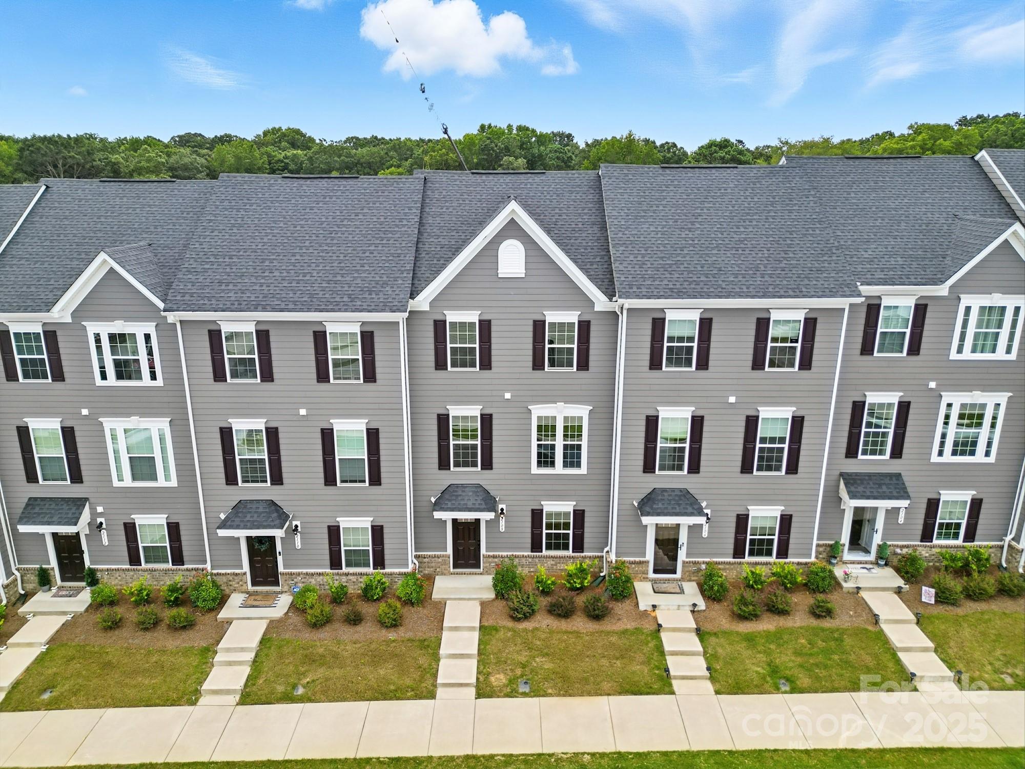 2108 Trout Lily Lane, Unit 198 Matthews, NC 28104 - Photo 4 of 45 a aerial view of multiple houses