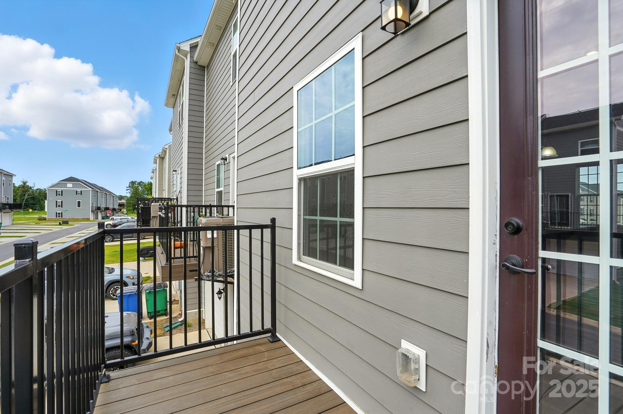 2108 Trout Lily Lane, Unit 198 Matthews, NC 28104 - Photo 41 of 45 a view of balcony with wooden floor