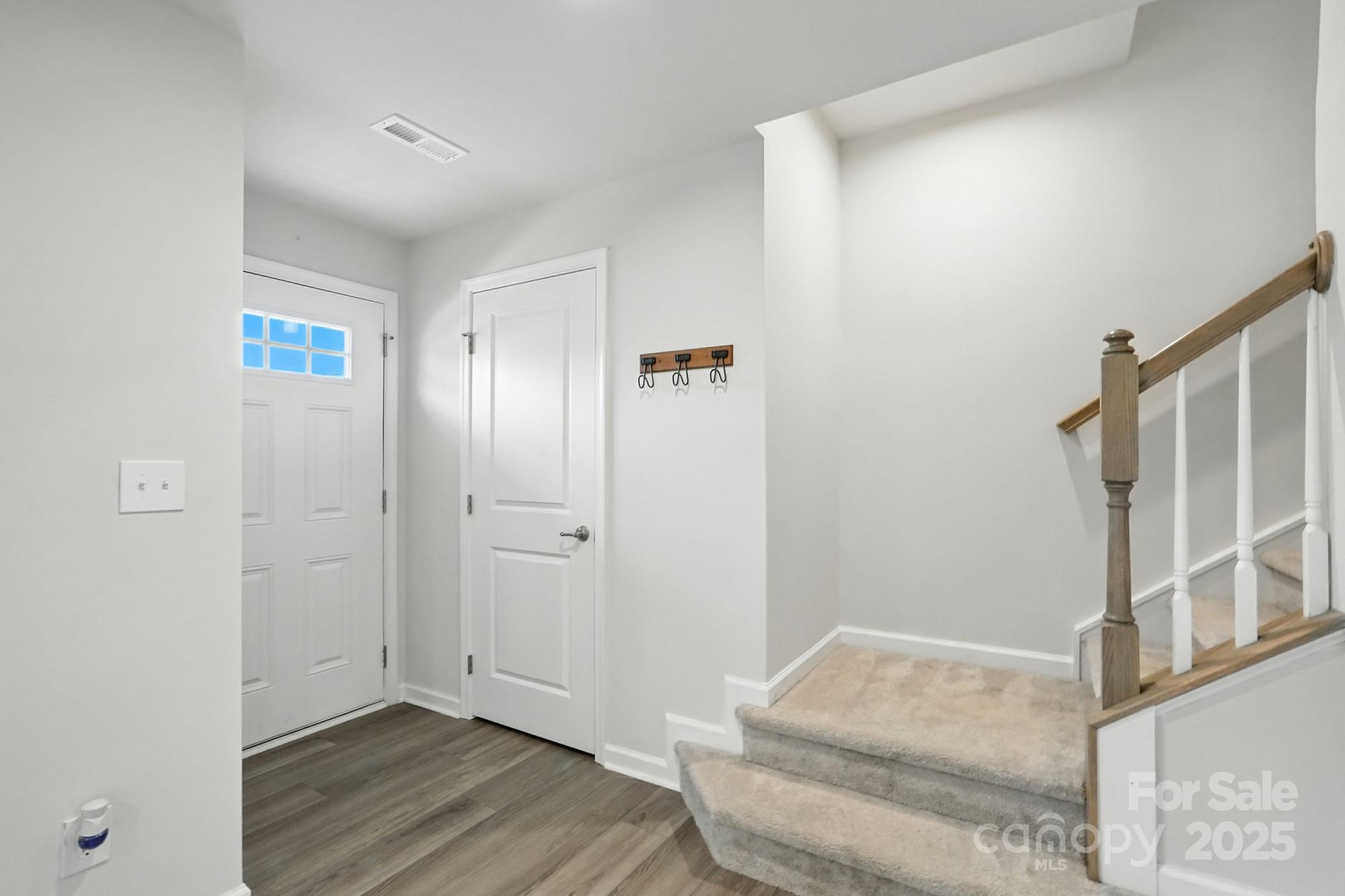 2108 Trout Lily Lane, Unit 198 Matthews, NC 28104 - Photo 6 of 45 a view of livingroom with furniture and wooden floor