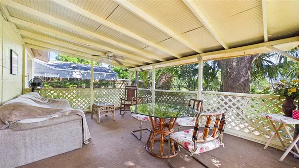 a building outdoor space with patio furniture and potted plants