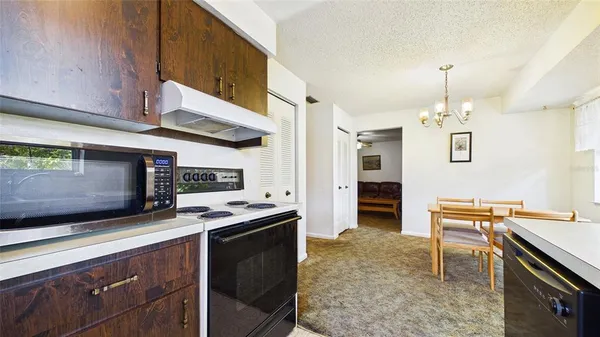 a kitchen that has a stove and a microwave