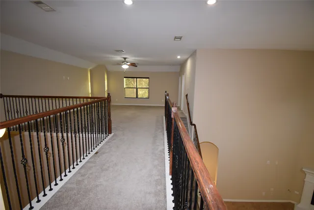 a view of a hallway with windows
