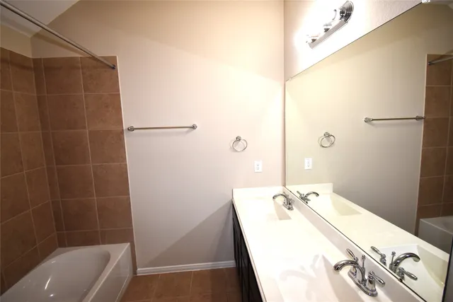 a bathroom with a sink and a bathtub