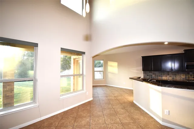 a view of a living room a window and a television