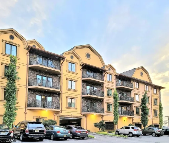 a view of a parked cars in front of a building