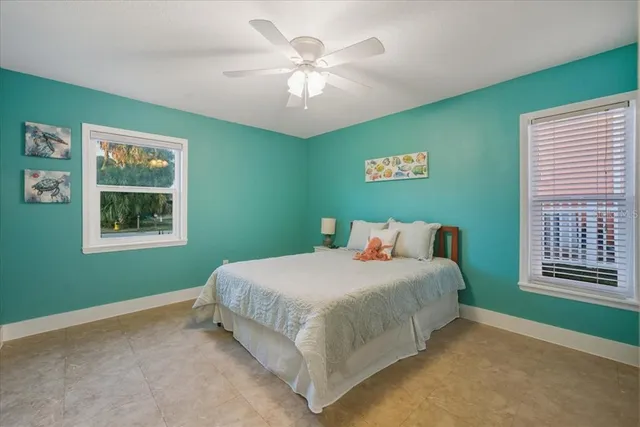 a view of a livingroom with furniture and a ceiling fan