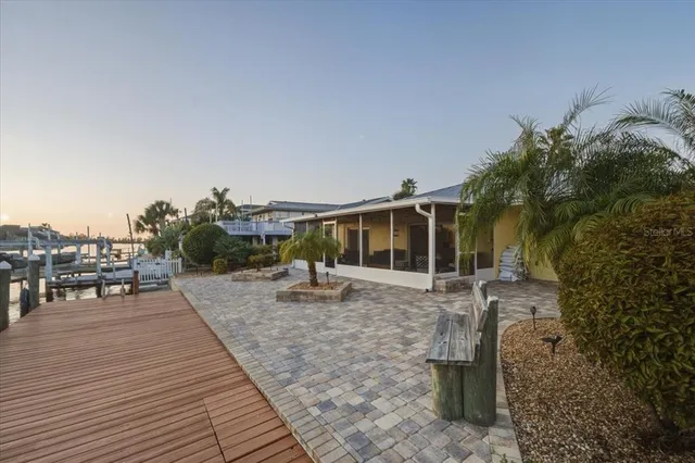 an aerial view of a houses with city view