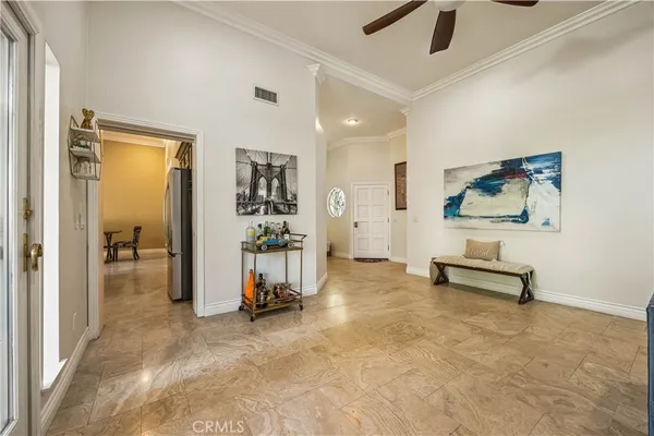 a view of a livingroom with a furniture and floor to ceiling window