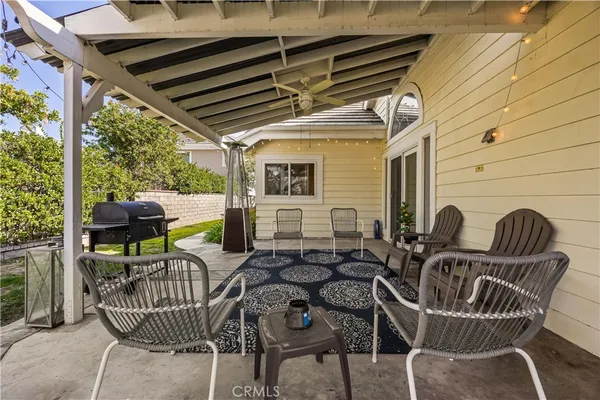 a view of an outdoor sitting area with furniture