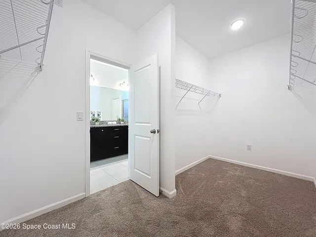 a view of a hallway with closet