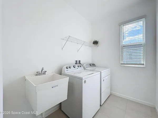 a utility room with dryer and washer