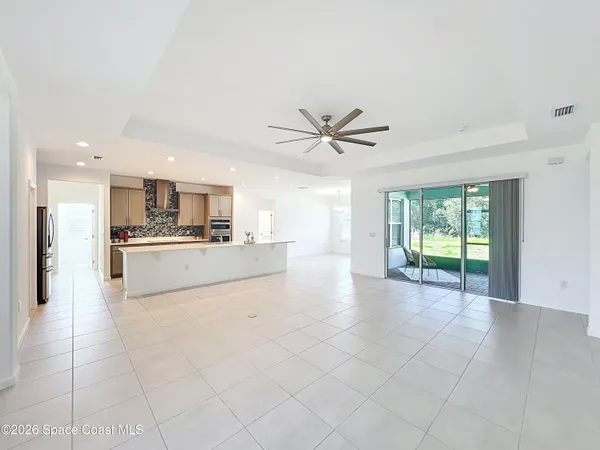a view of a kitchen with a sink and a window