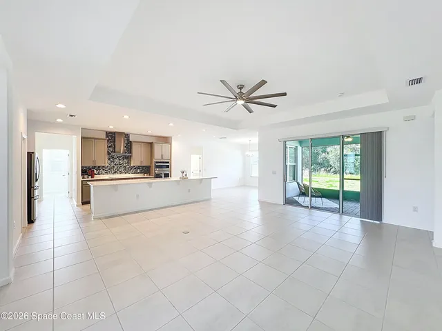 a view of a kitchen with a sink and a window