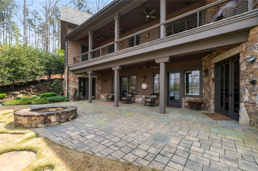 195 Village View Drive Sunset, SC 29685 - Photo 5 of 48 This captivating outdoor living space features a spacious patio and a built-in fire pit.