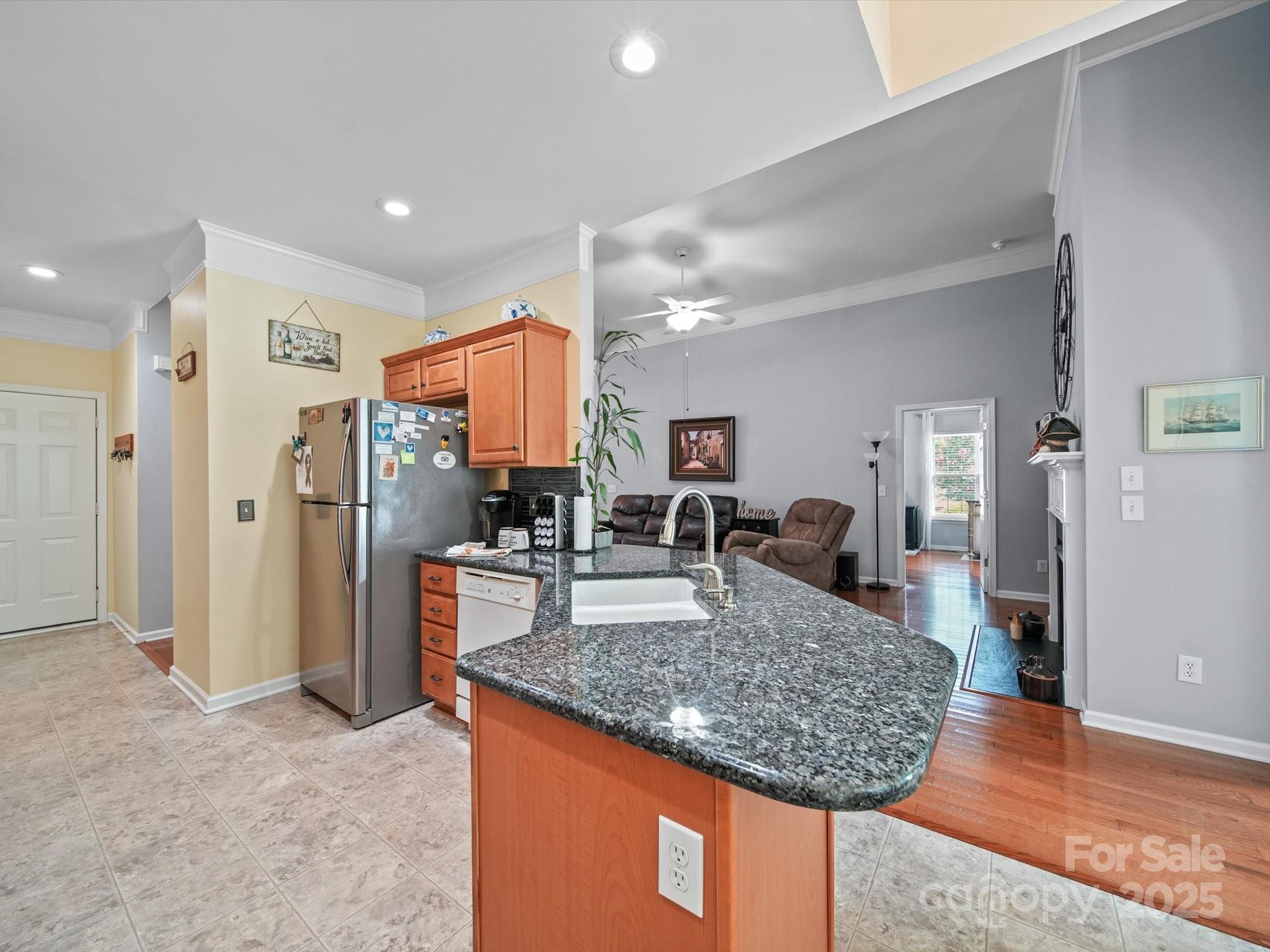 11761 Crossroads Place Concord, NC 28025 - Photo 11 of 32 a view of living room and kitchen