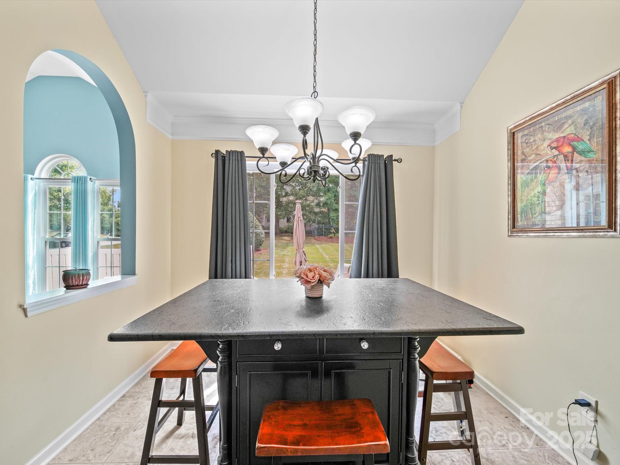 11761 Crossroads Place Concord, NC 28025 - Photo 17 of 32 a view of a dining room with furniture window and outside view