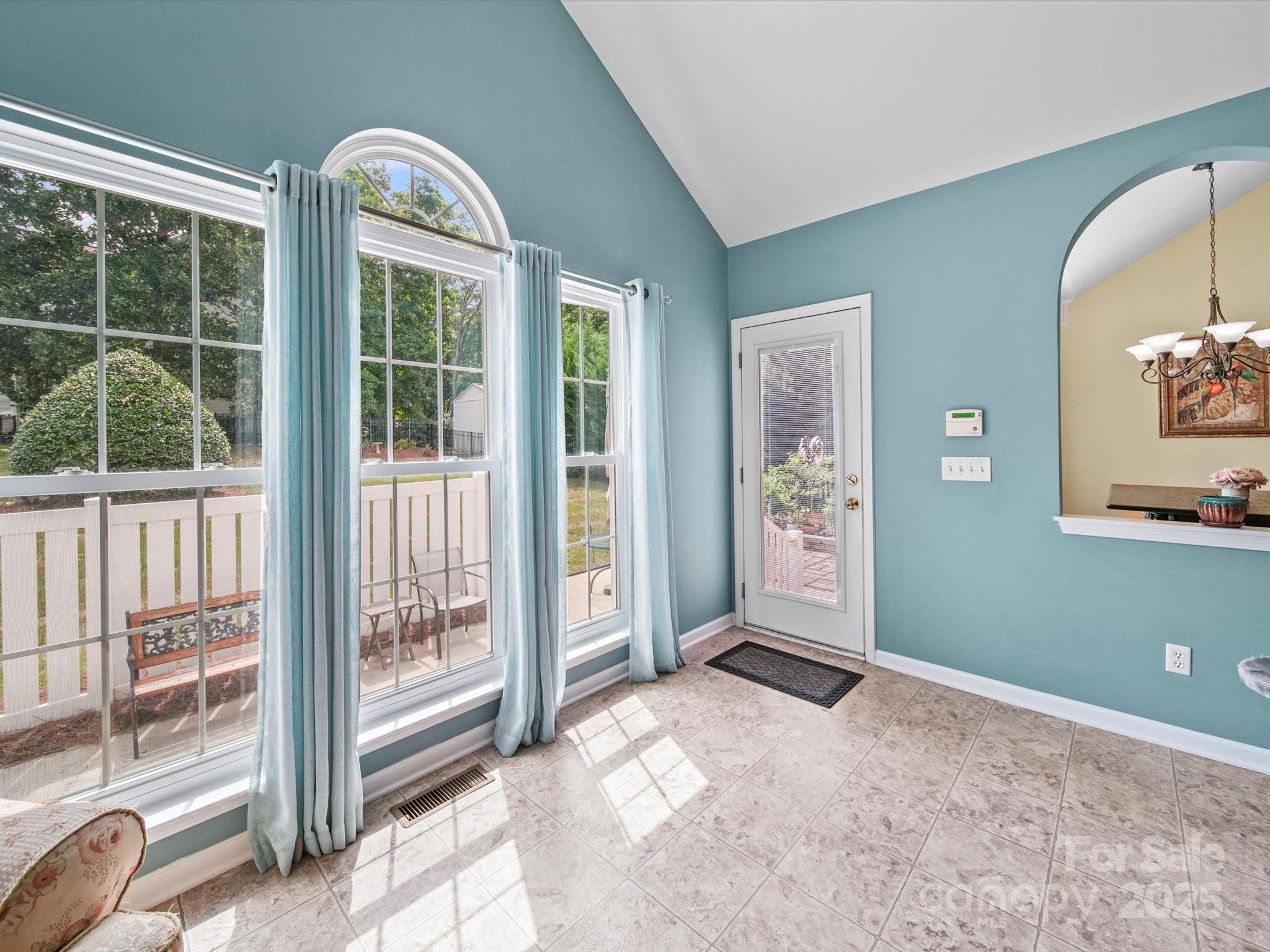 11761 Crossroads Place Concord, NC 28025 - Photo 18 of 32 a view of a room with large windows