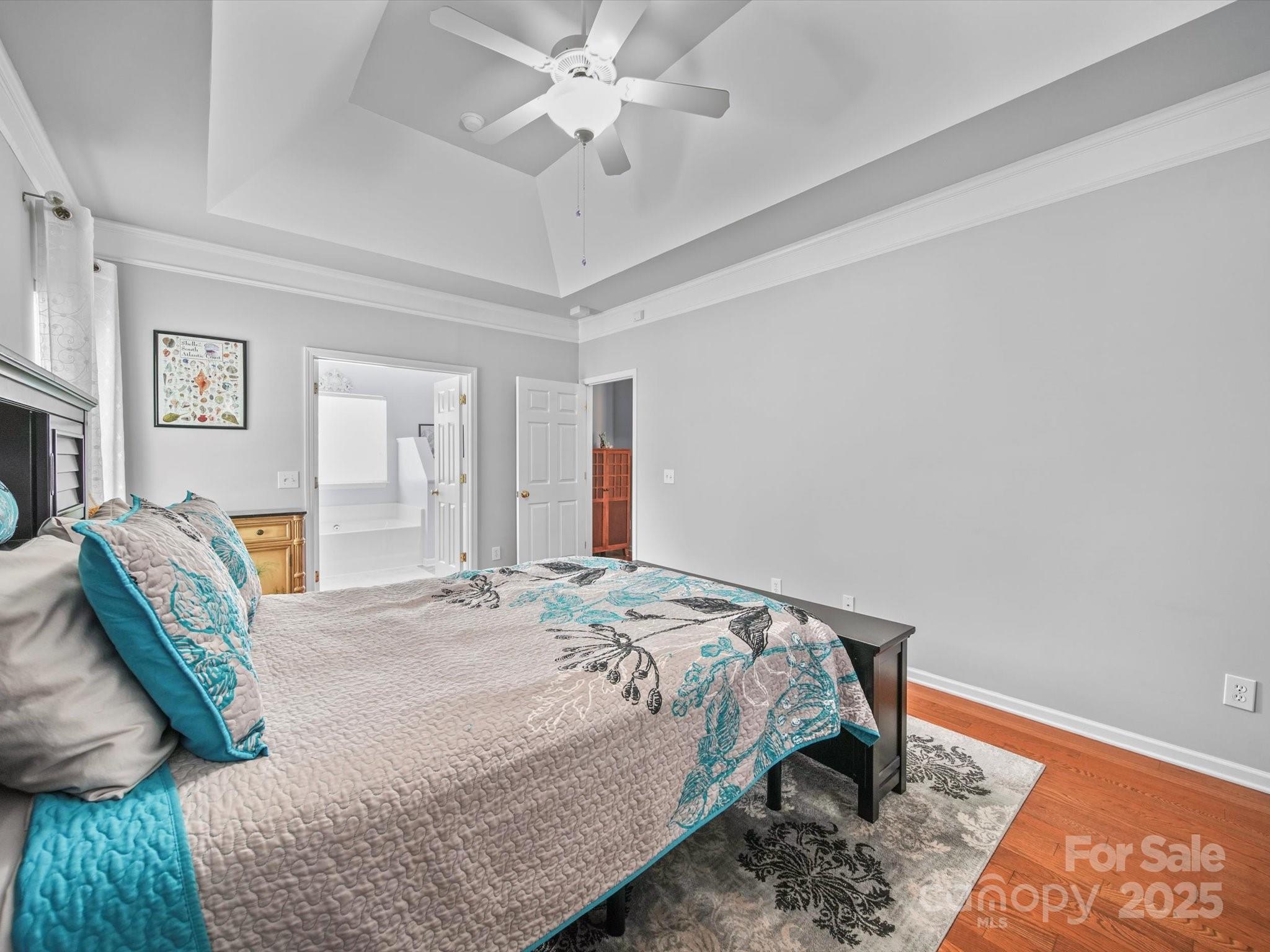 11761 Crossroads Place Concord, NC 28025 - Photo 22 of 32 a bedroom with a bed and a chandelier
