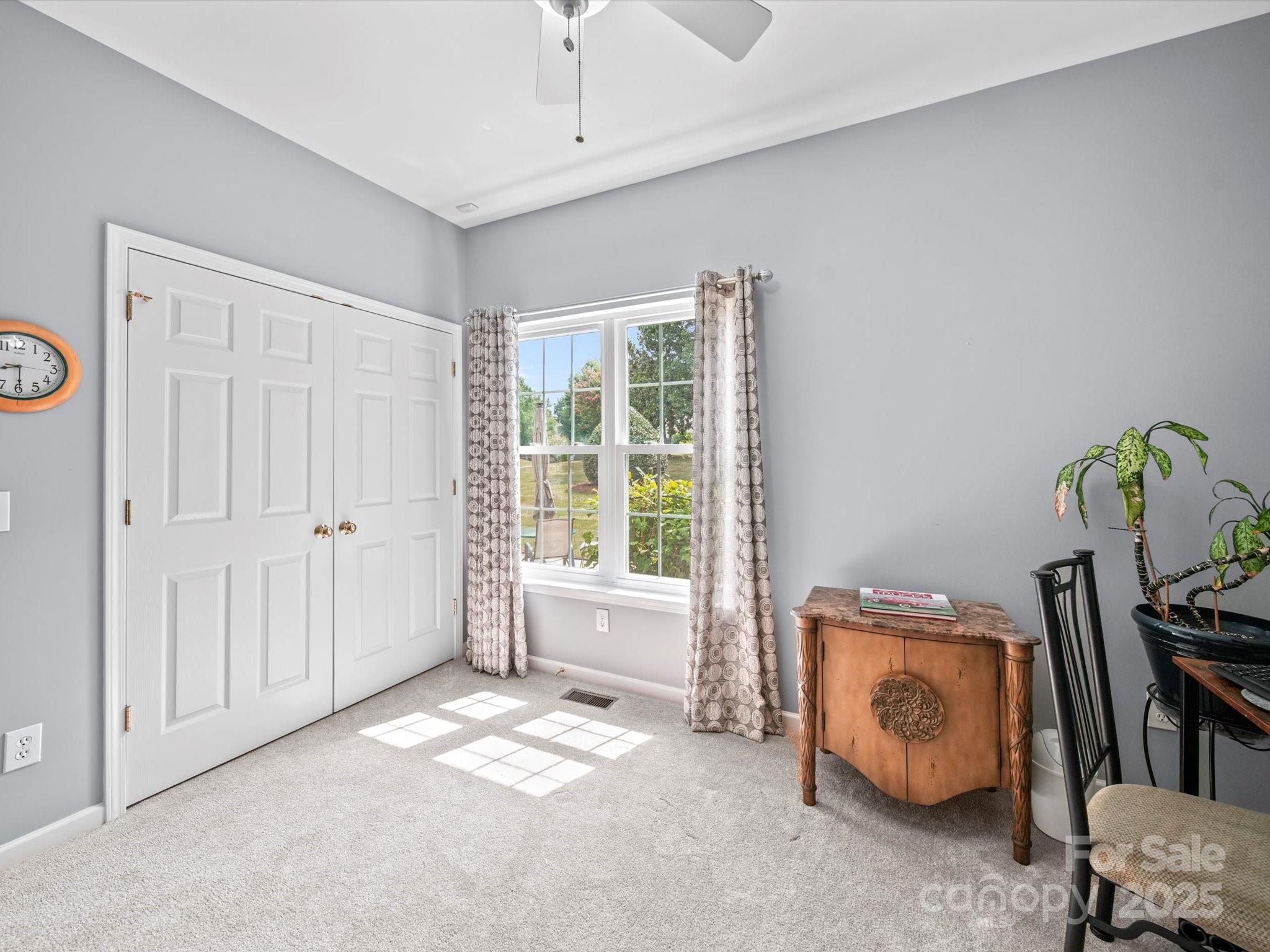 11761 Crossroads Place Concord, NC 28025 - Photo 25 of 32 a view of room with window and a ceiling fan