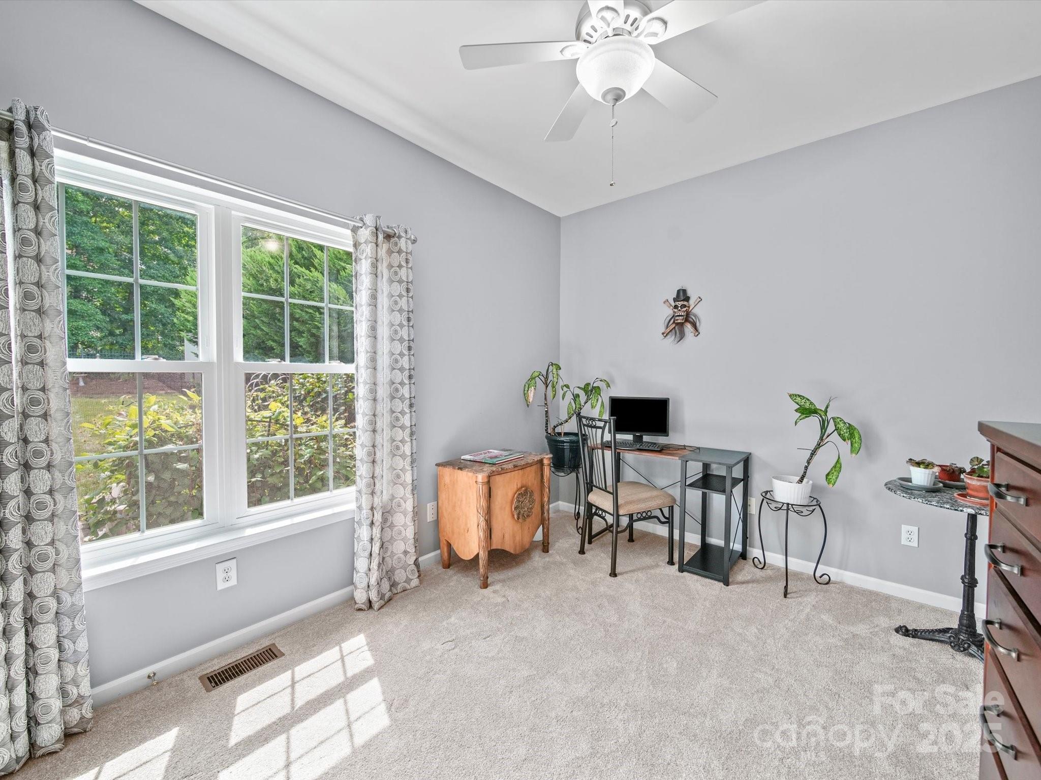 11761 Crossroads Place Concord, NC 28025 - Photo 26 of 32 a living room with furniture and a window