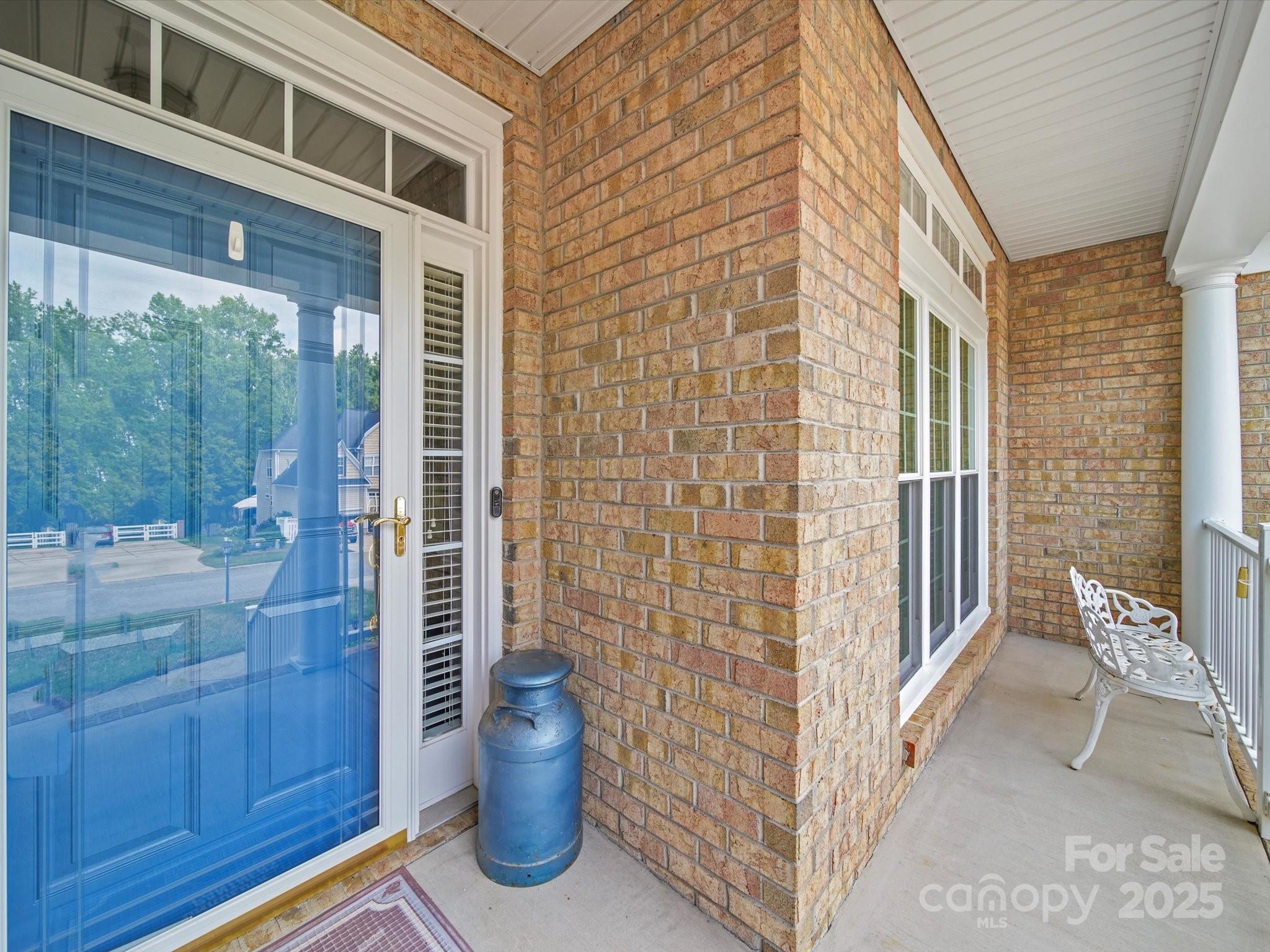 11761 Crossroads Place Concord, NC 28025 - Photo 3 of 32 a view of a porch with a chairs and table