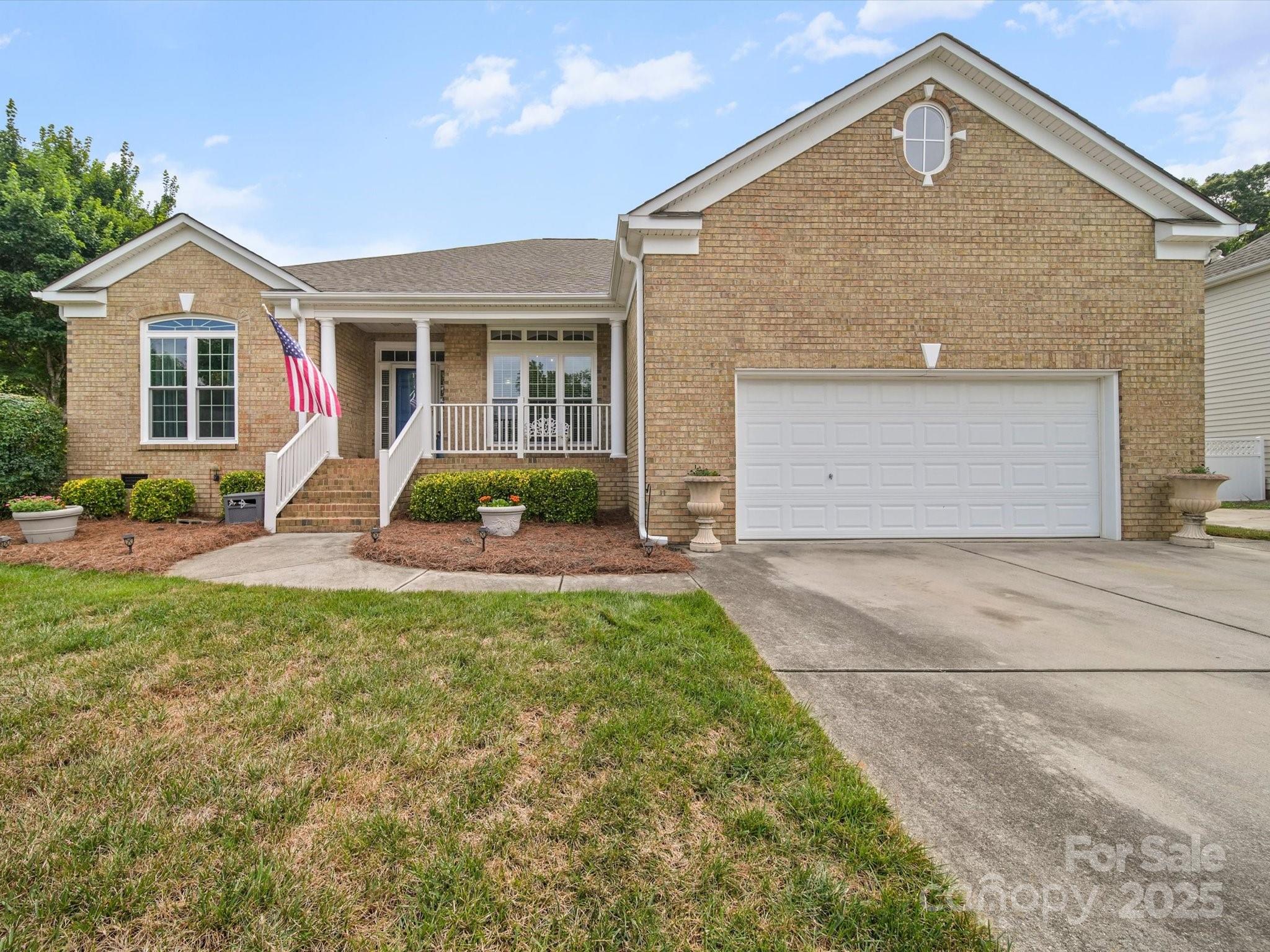 11761 Crossroads Place Concord, NC 28025 - Photo 31 of 32 a front view of a house with garden