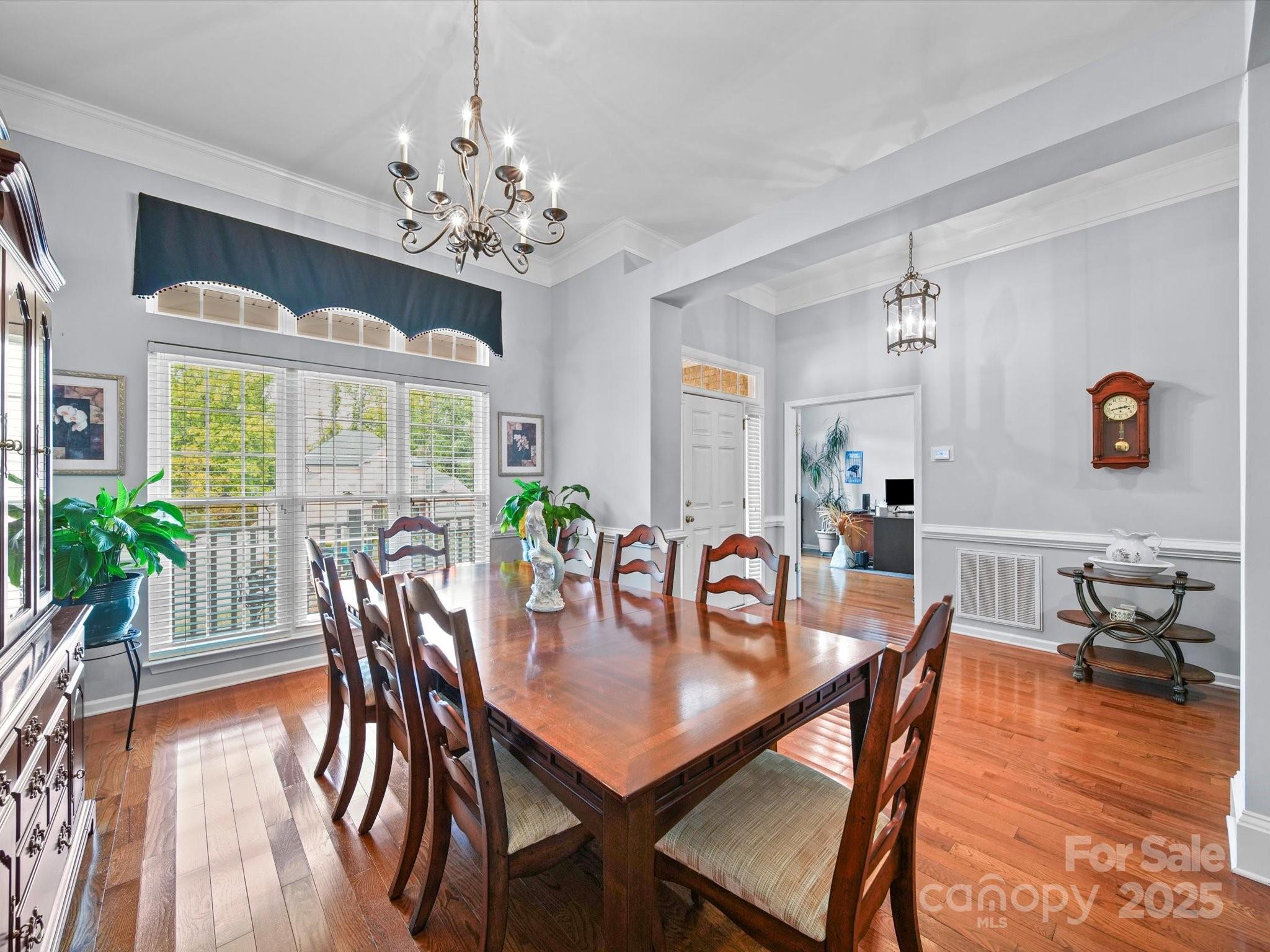 11761 Crossroads Place Concord, NC 28025 - Photo 4 of 32 a view of a dining room with furniture window and wooden floor