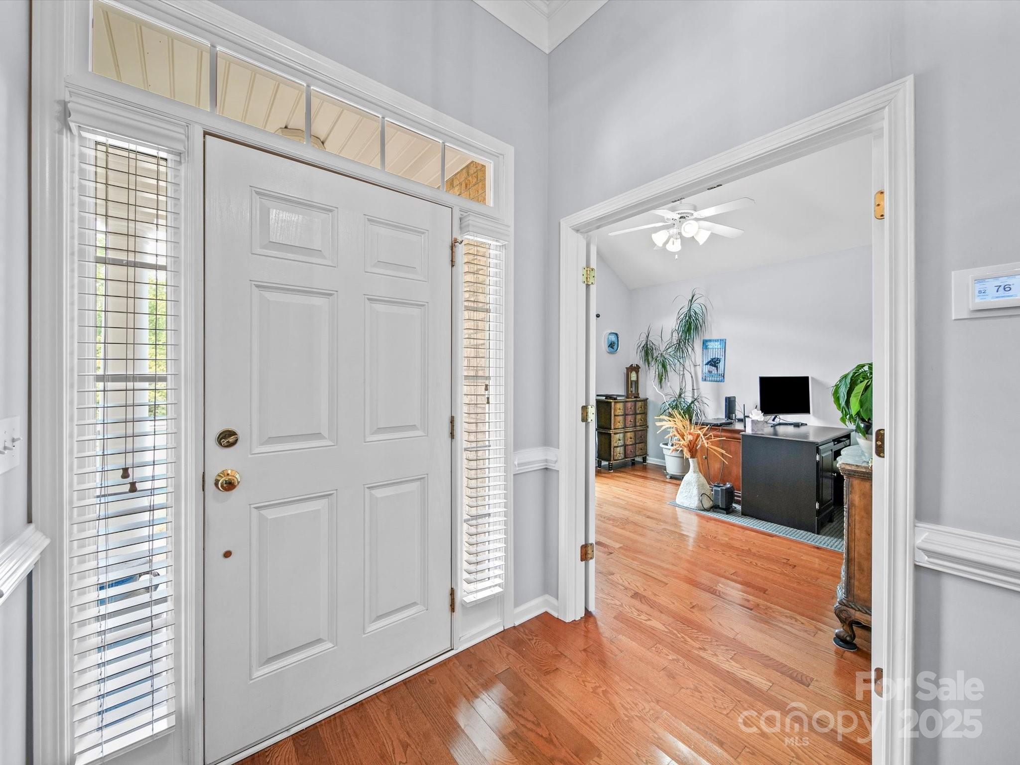 11761 Crossroads Place Concord, NC 28025 - Photo 6 of 32 a living room with furniture and a wooden floor
