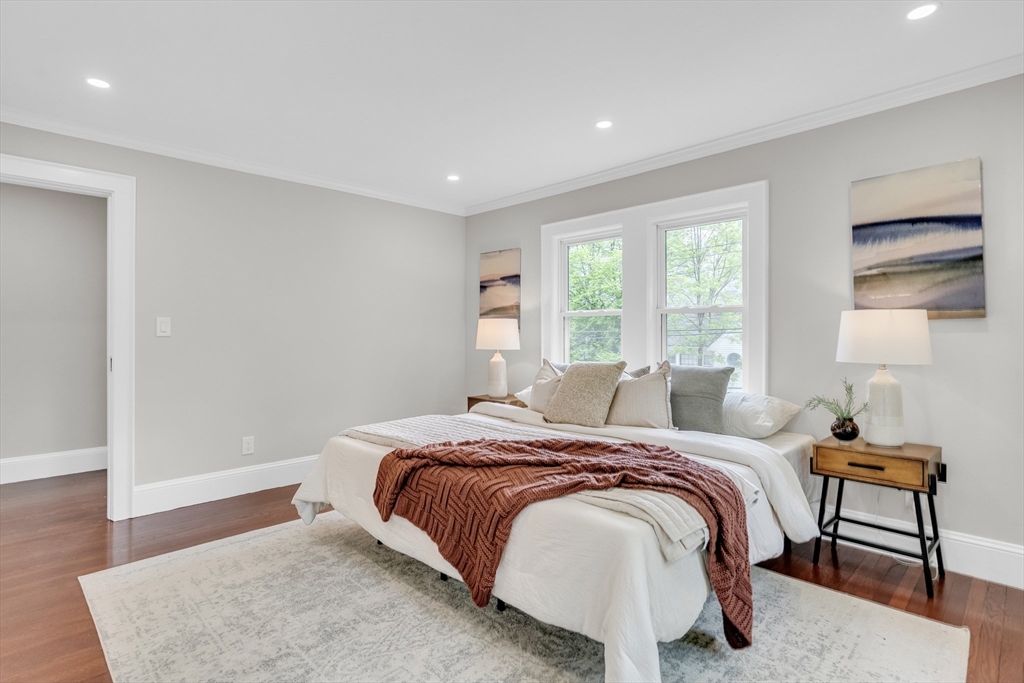 56 Pine Hill Road Dedham, MA 02026 - Photo 18 of 32 a bedroom with a bed and wooden floor