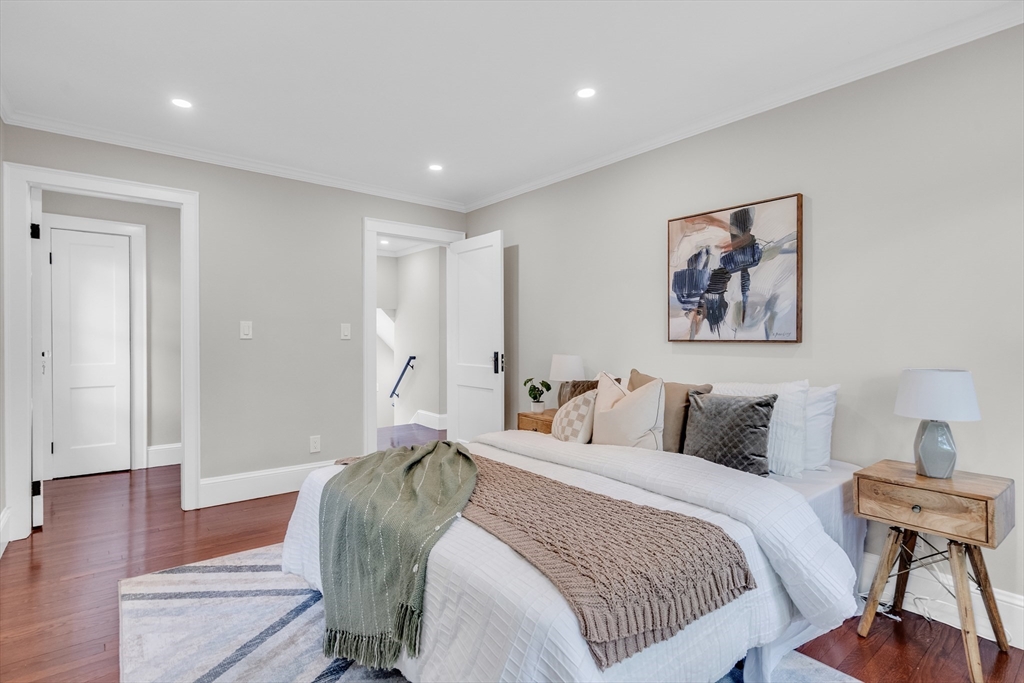 56 Pine Hill Road Dedham, MA 02026 - Photo 21 of 32 a bedroom with bed and a painting on the wall